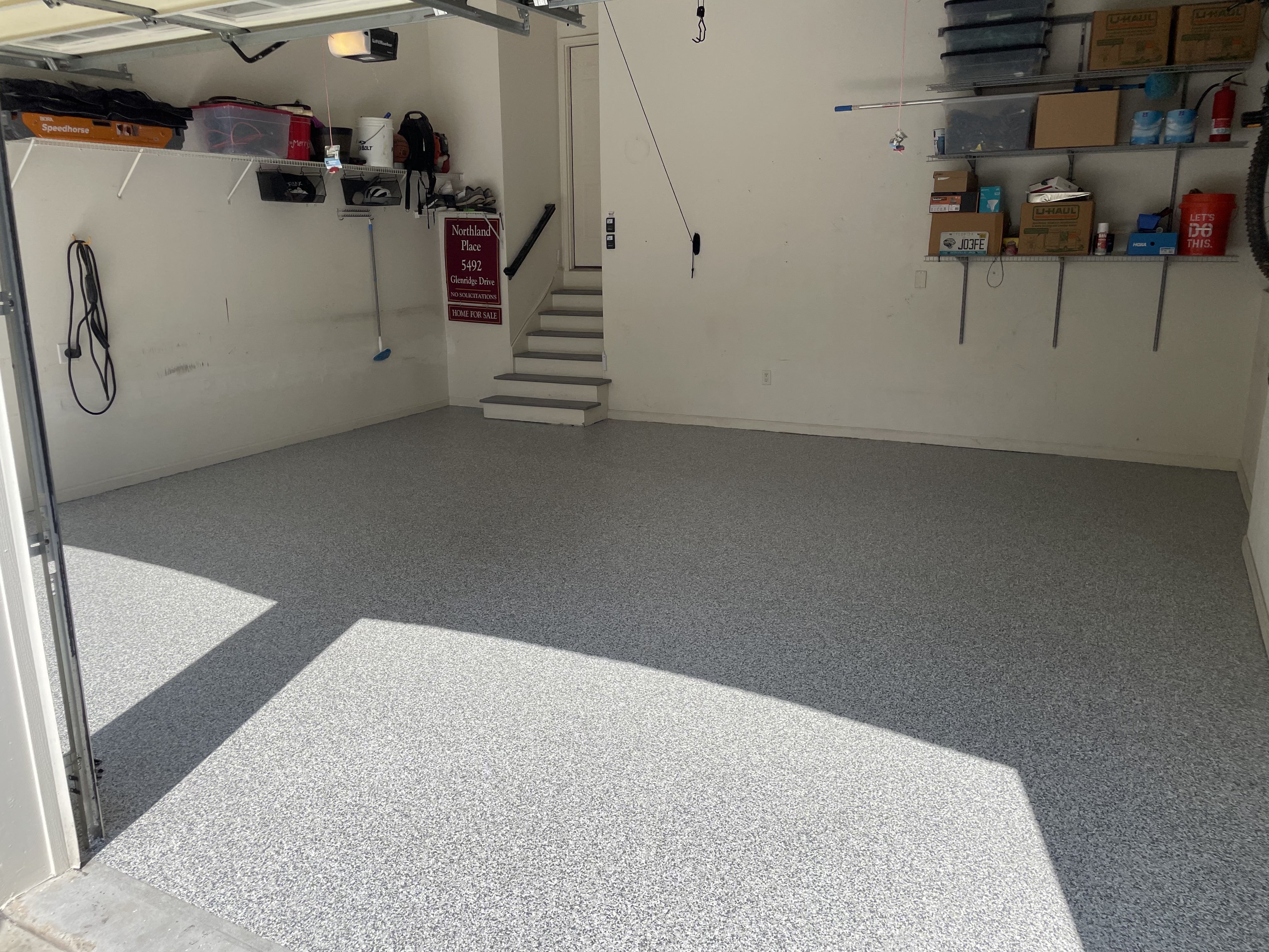 After: Bright tan polyaspartic garage floor