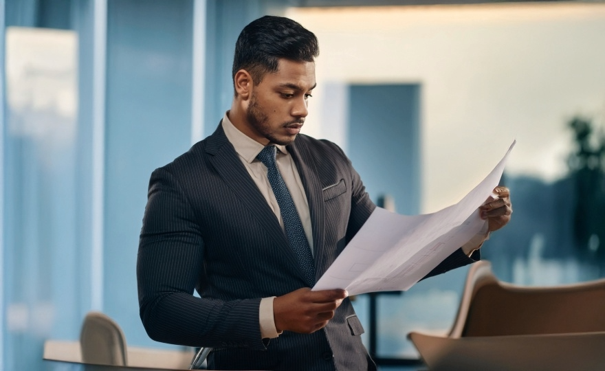 Motivated entrepreneur looking at plans